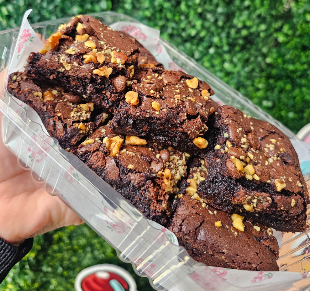 Brownies topped with nuts.